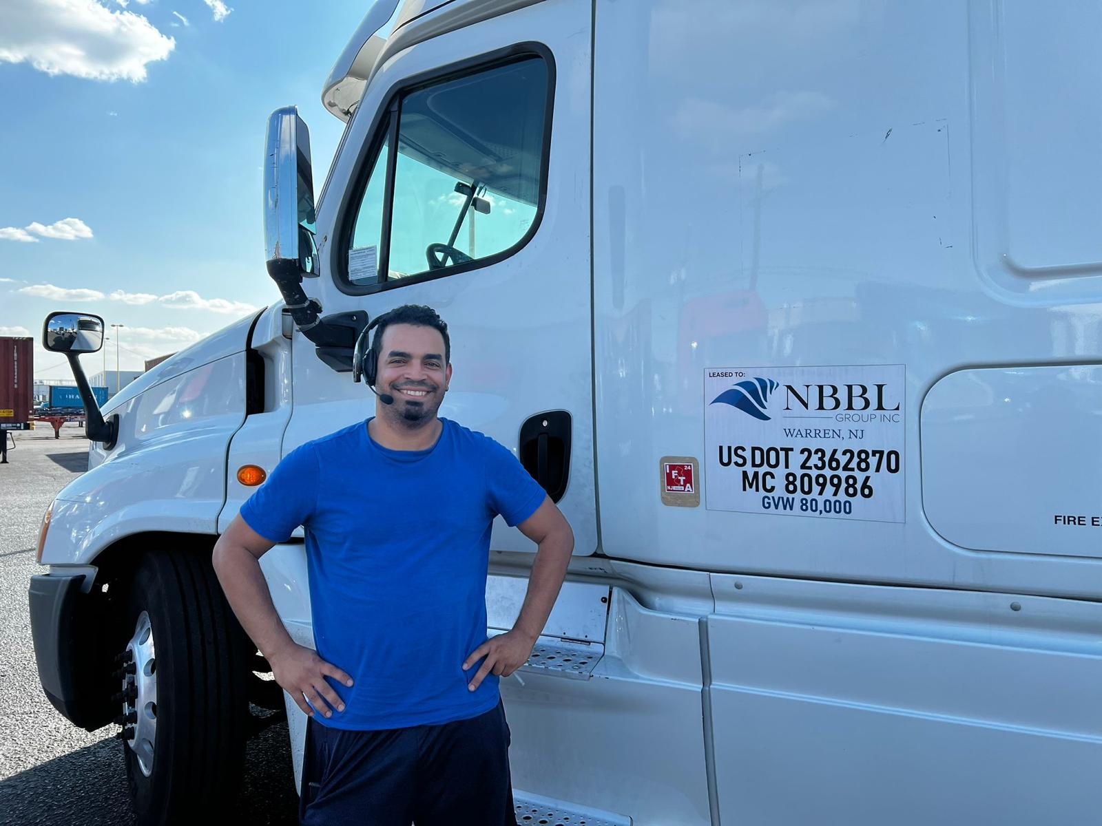 NBBL Group experienced driver next to Freightliner tractor at NY/NJ port terminal — US DOT 2362870